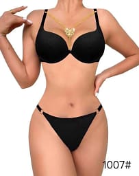 Close-up of the butterfly design and decorative necklace on the lingerie bra.